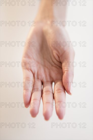 Cape Verdean woman with hand outstretched