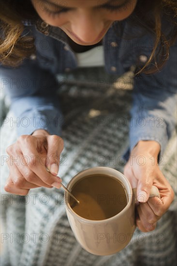 Cape Verdean woman drinking coffee