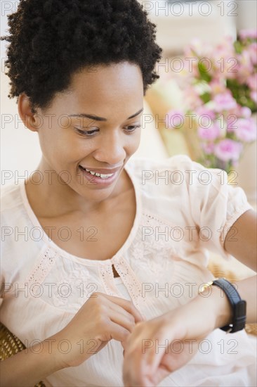 African American woman checking the time