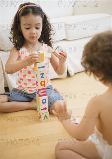 Mixed race children playing with blocks