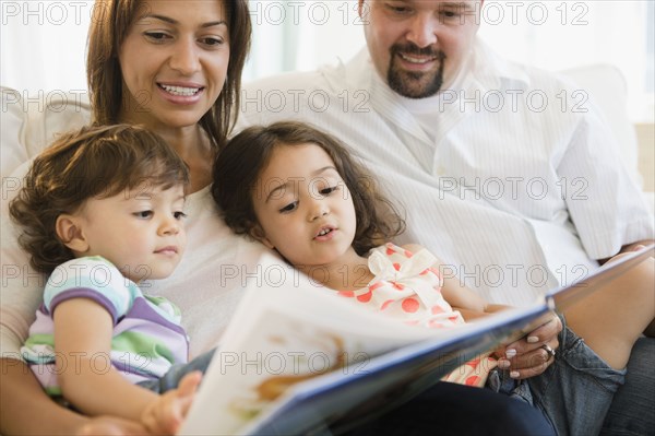 Family reading book together