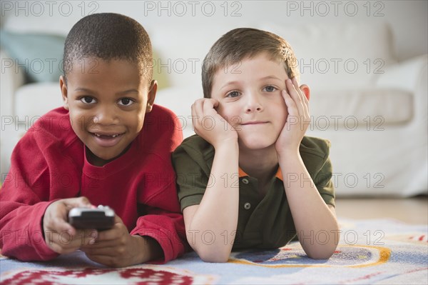 Boys watching television together