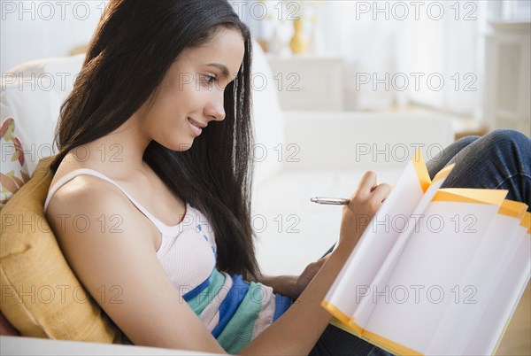 Hispanic teenager doing homework
