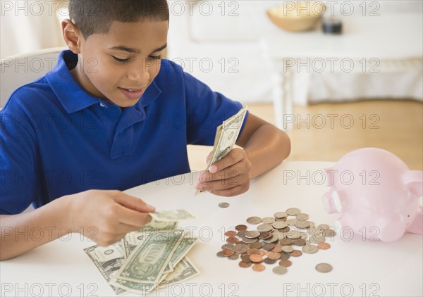 Hispanic boy counting money