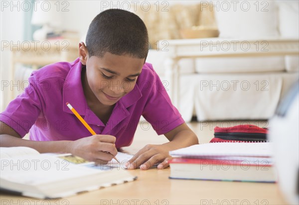 Hispanic boy doing homework