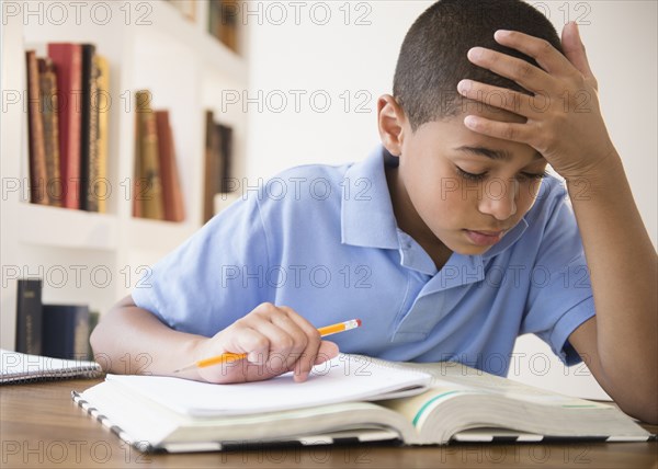 Hispanic boy doing homework