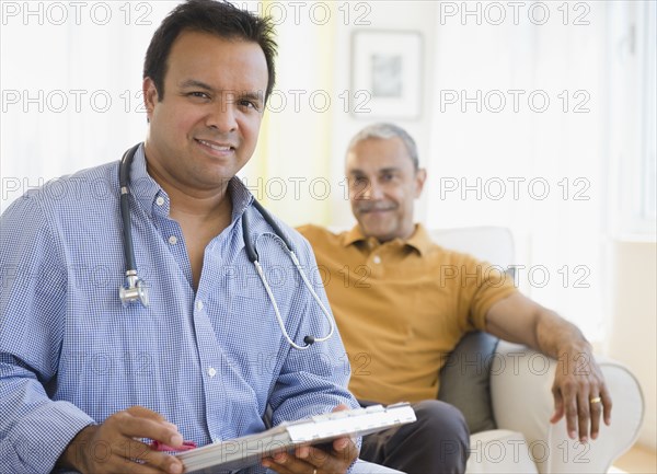 Hispanic doctor examining patient