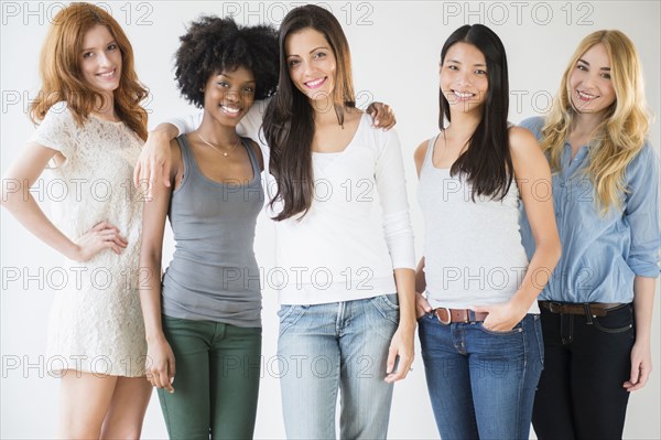 Smiling women standing together