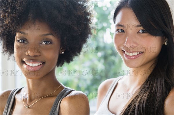 Smiling women standing together