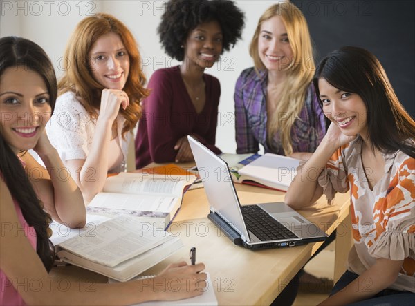 Businesswomen smiling in meeting