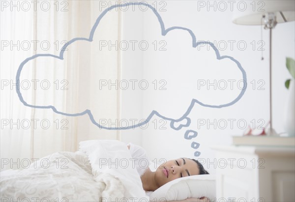 Hispanic woman sleeping with empty thought bubble