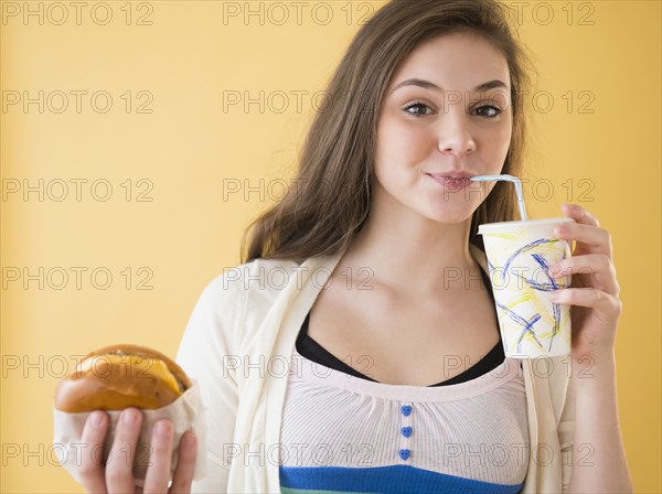 Hispanic girl having fast food