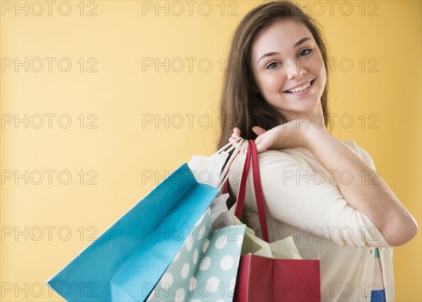 Hispanic girl carrying shopping bags