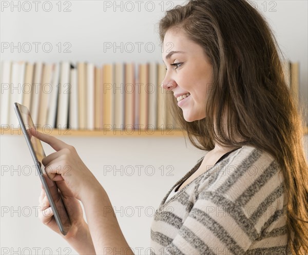 Hispanic girl using tablet computer