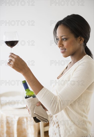 African American woman having glass of wine