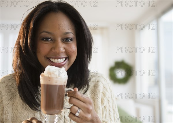 African American woman drinking hot chocolate