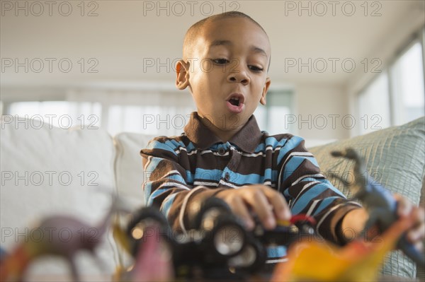 African American boy playing with toys