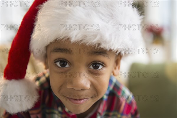 African American boy wearing Santa hat