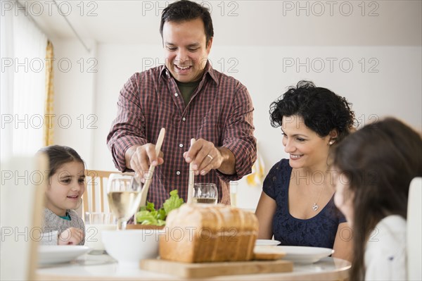 Family eating together at table