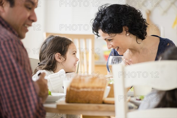 Family eating together at table