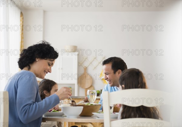 Family eating together at table