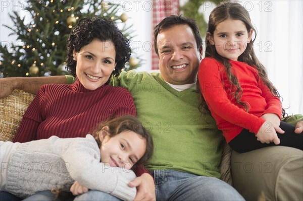 Family relaxing together on sofa