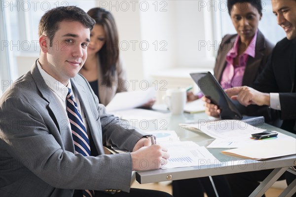 Businessman smiling in meeting