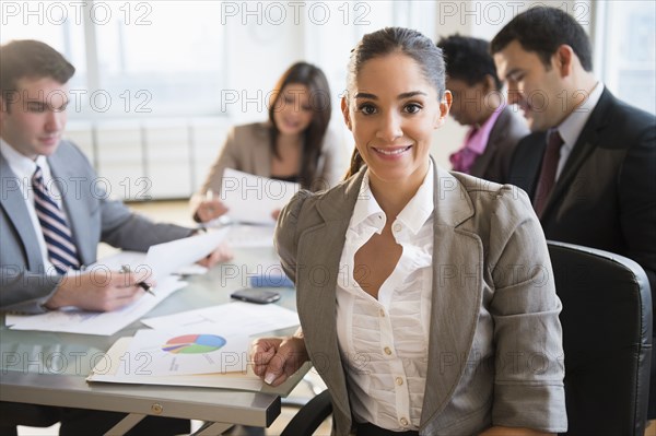 Businesswoman smiling in meeting