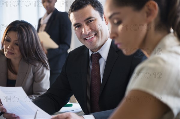 Businessman smiling in meeting