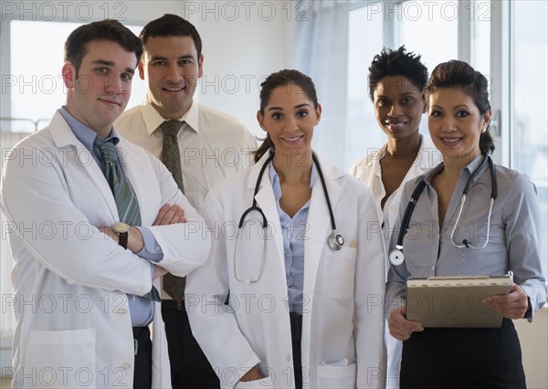 Doctors smiling together in office