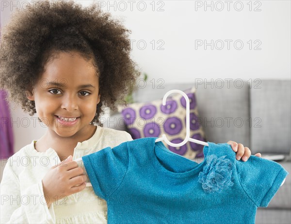 African American girl showing new shirt