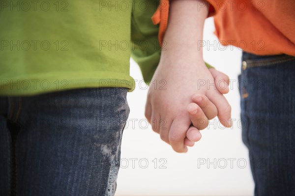 Close up of girls holding hands