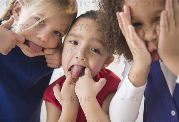 Girls making faces together