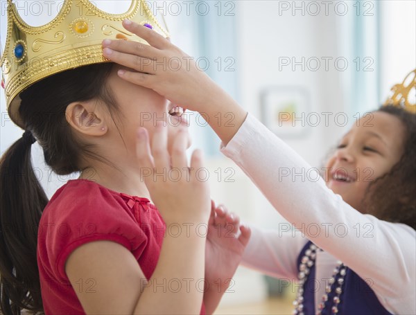 Girls playing dress up together