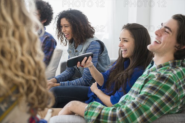 Friends watching television together