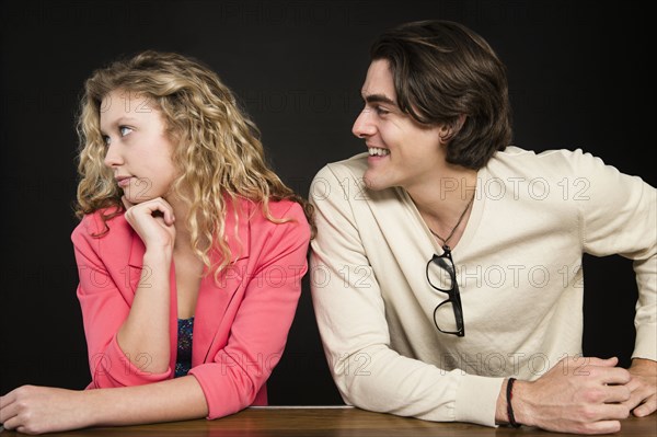 Man talking to uninterested woman