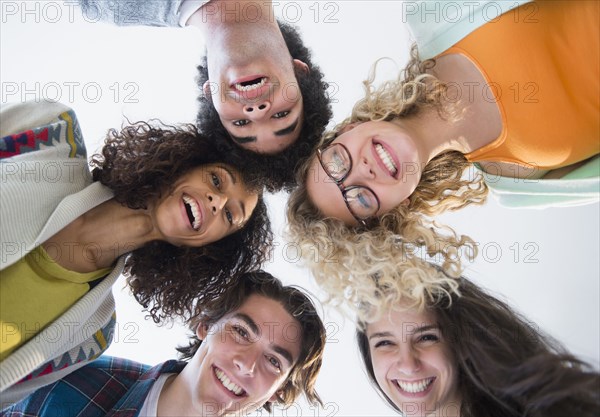 Friends huddled in circle together