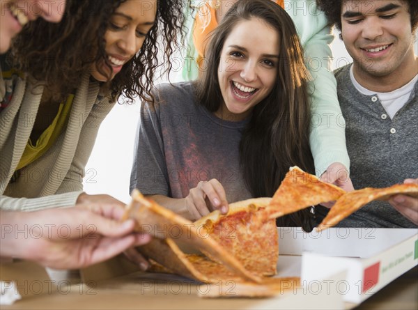 Friends having pizza together