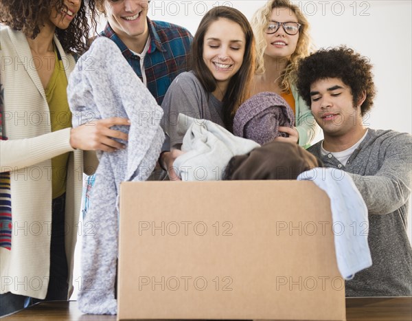 Friends packing boxes together
