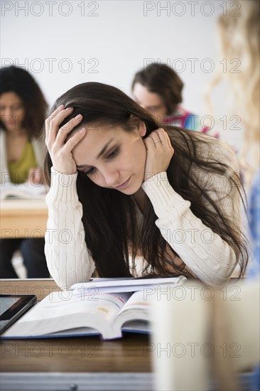 Student reading in class