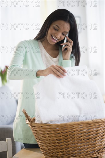 Mixed race woman talking on cell phone