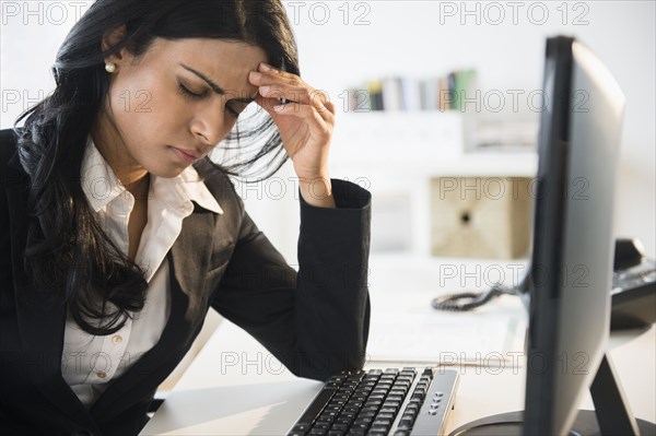 Indian businesswoman working at desk