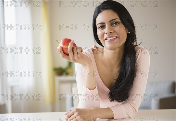 Indian woman eating fruit