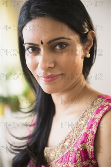 Indian woman wearing bindi and traditional garb