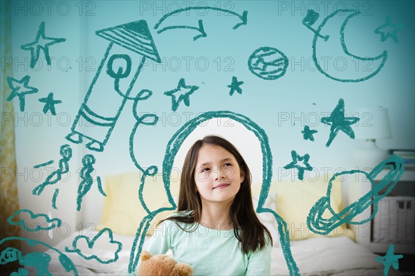 Mixed race girl with space doodles surrounding head