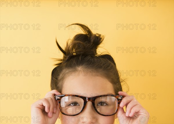 Mixed race girl wearing glasses