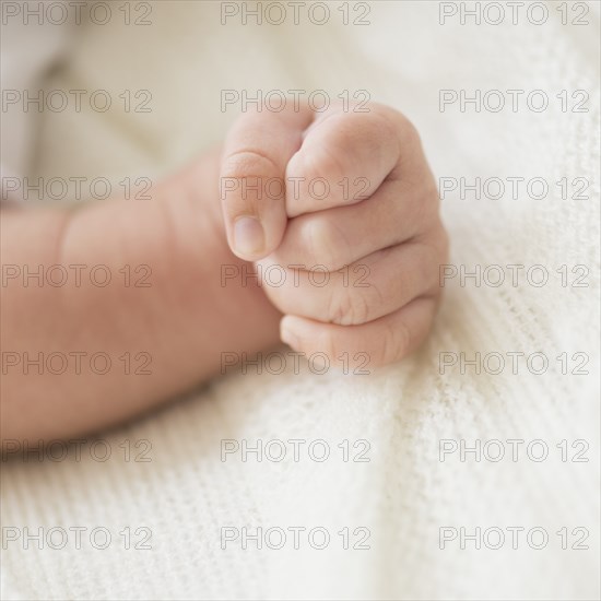 Close up of Hispanic infant's fist