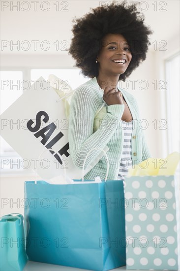 Mixed race woman with shopping bags