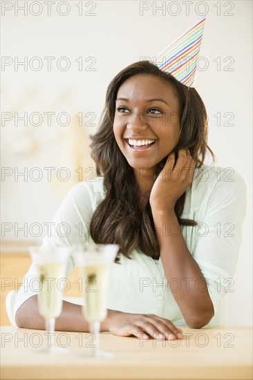 Black woman celebrating with champagne