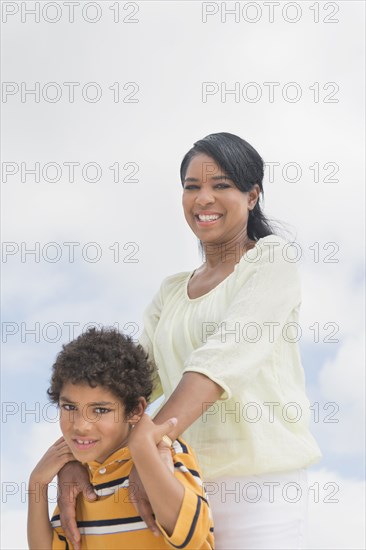 Mother and son hugging outdoors